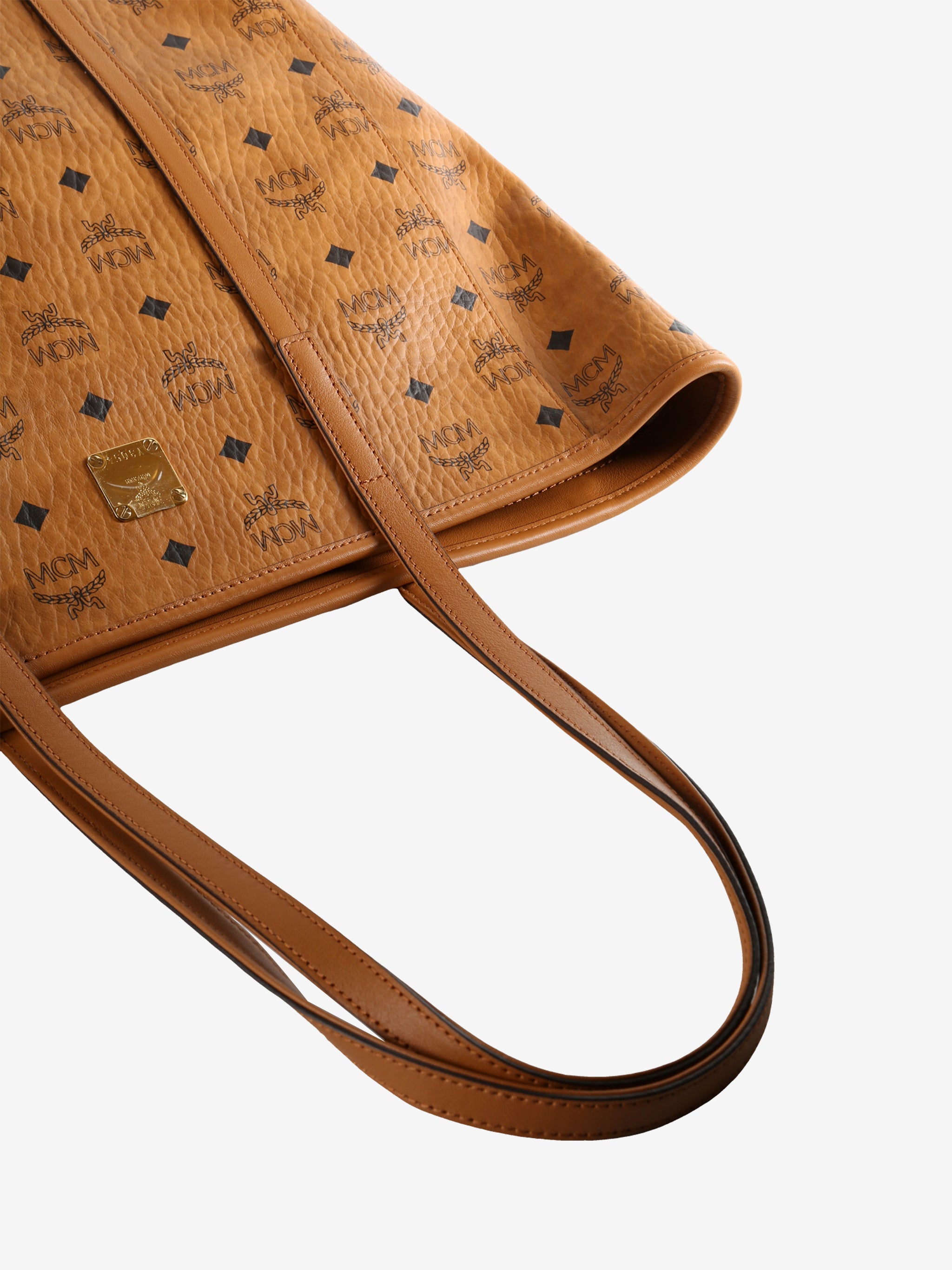 Close up of brown bag  showing texture of the leather fabric