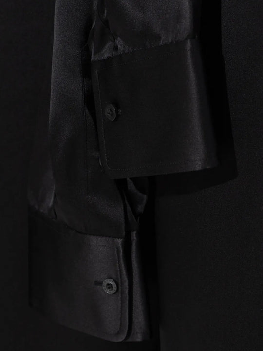 Close up of the black pants, showing texture of the silk fabric