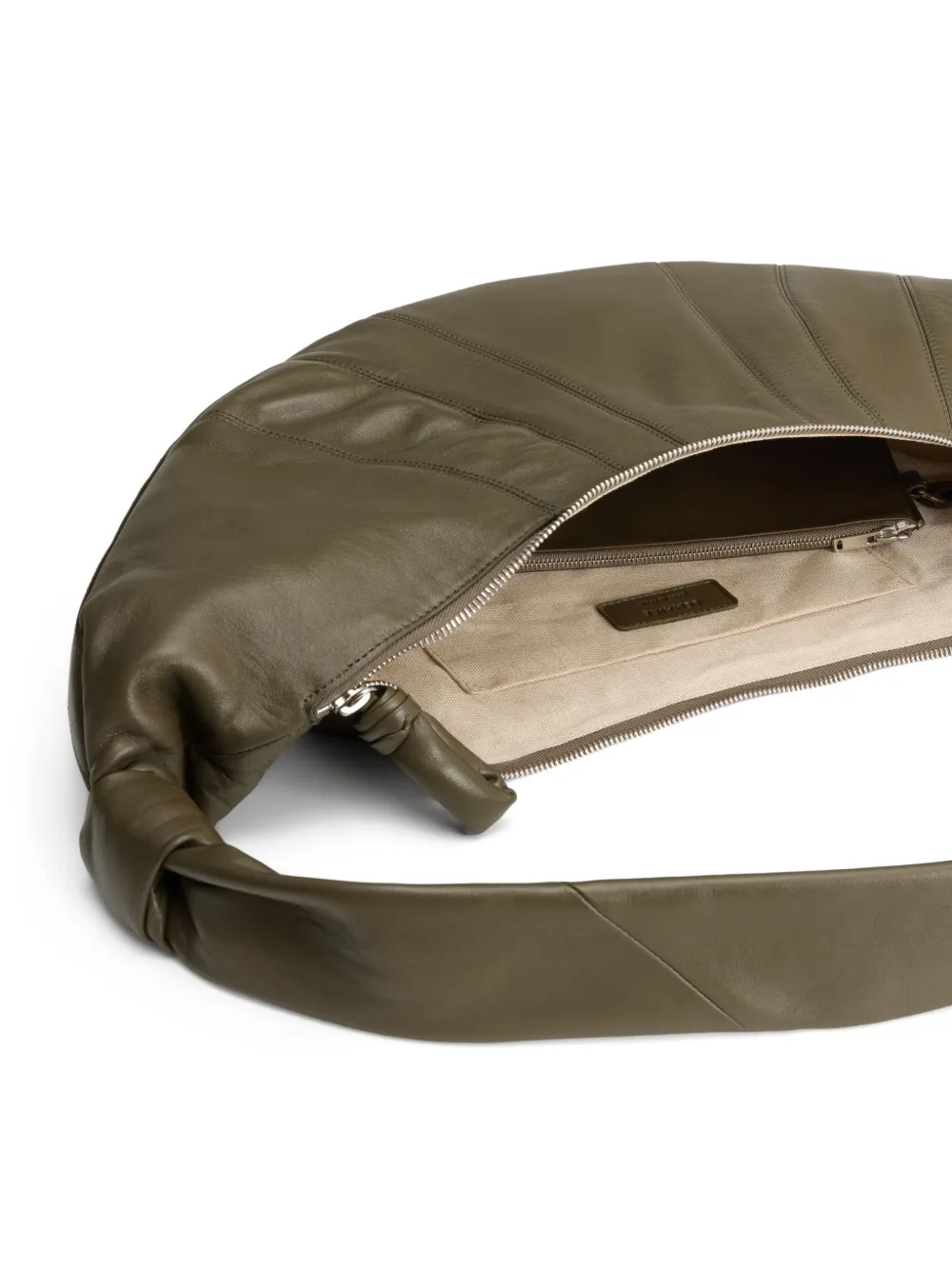 Close up of the green bag, showing texture of the leather fabric