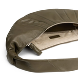 Close up of the green bag, showing texture of the leather fabric