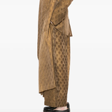 Brown pants worn by a person, showing the pants fit