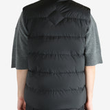 Black vest worn by a person, showing the vest's fit