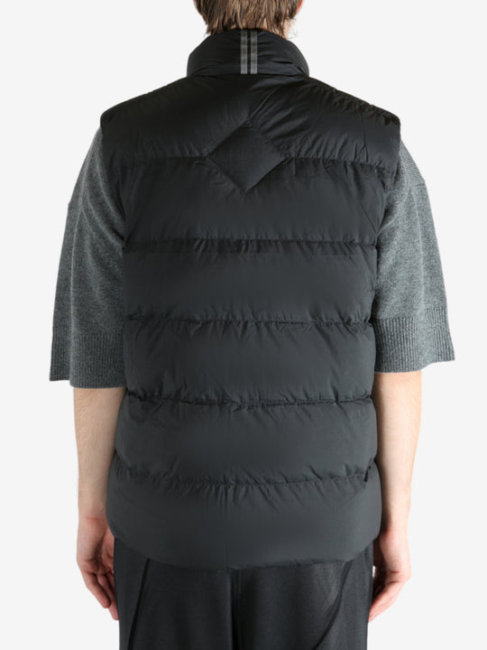 Black vest worn by a person, showing the vest's fit