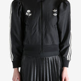 Black blouse worn by a person, showing the blouse's fit