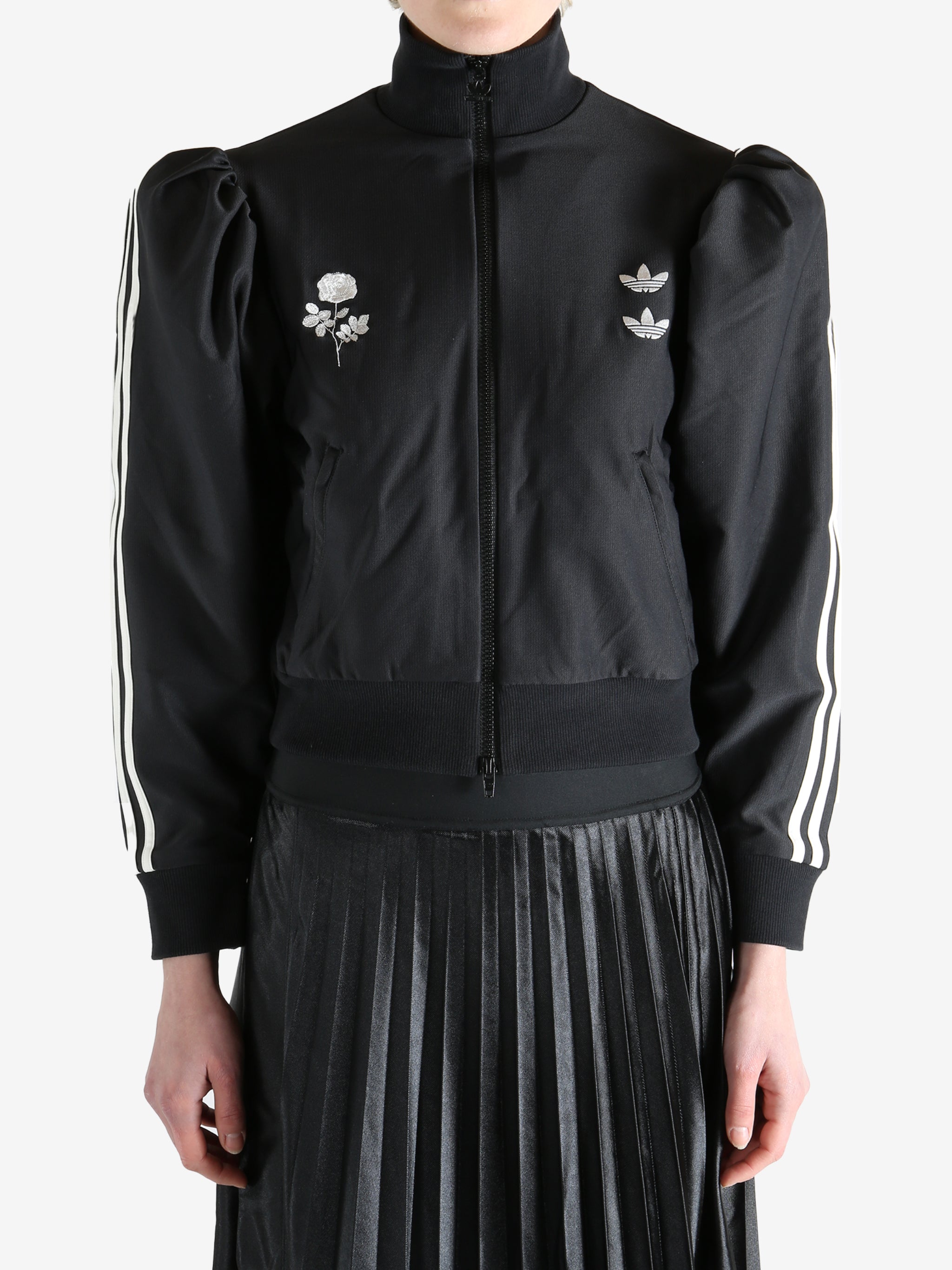 Black blouse worn by a person, showing the blouse's fit