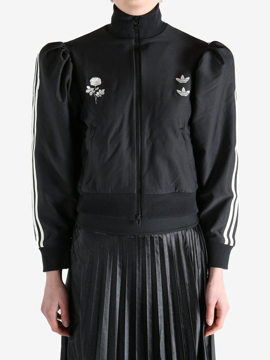 Black blouse worn by a person, showing the blouse's fit