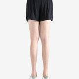 Black shorts worn by a person, showing the shorts' fit