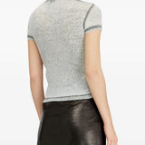 Grey tops worn by a person, showing the top's fit