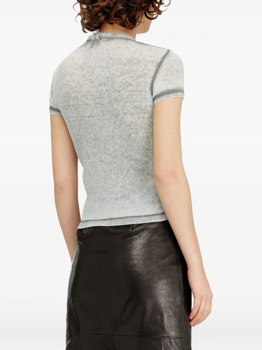 Grey tops worn by a person, showing the top's fit