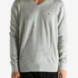 Grey sweater worn by a person, showing the sweater's fit