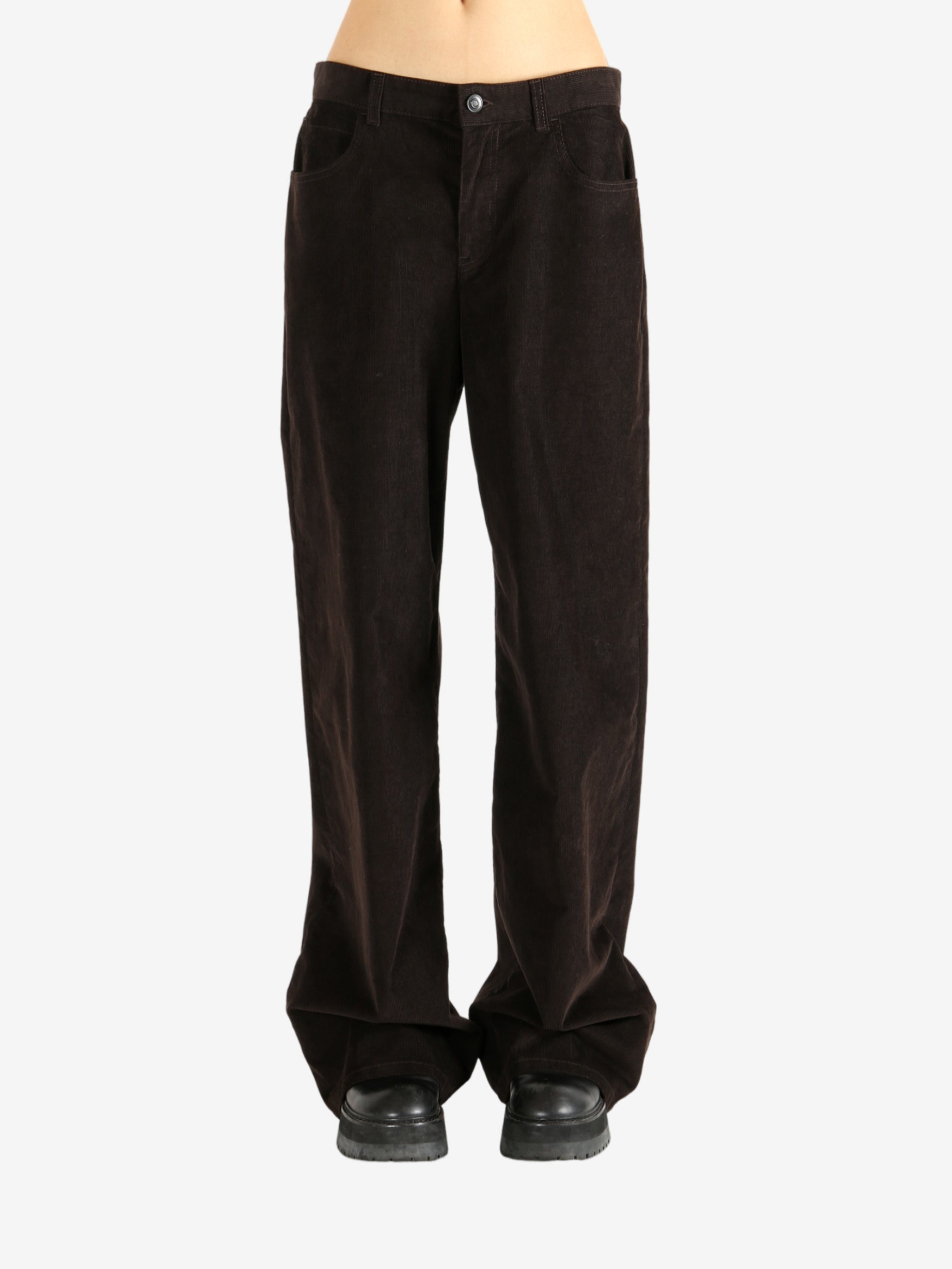 Brown pants worn by a person, showing the pants' fit