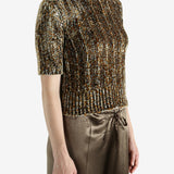 Grey knitwear worn by a person, showing the knitwear's fit