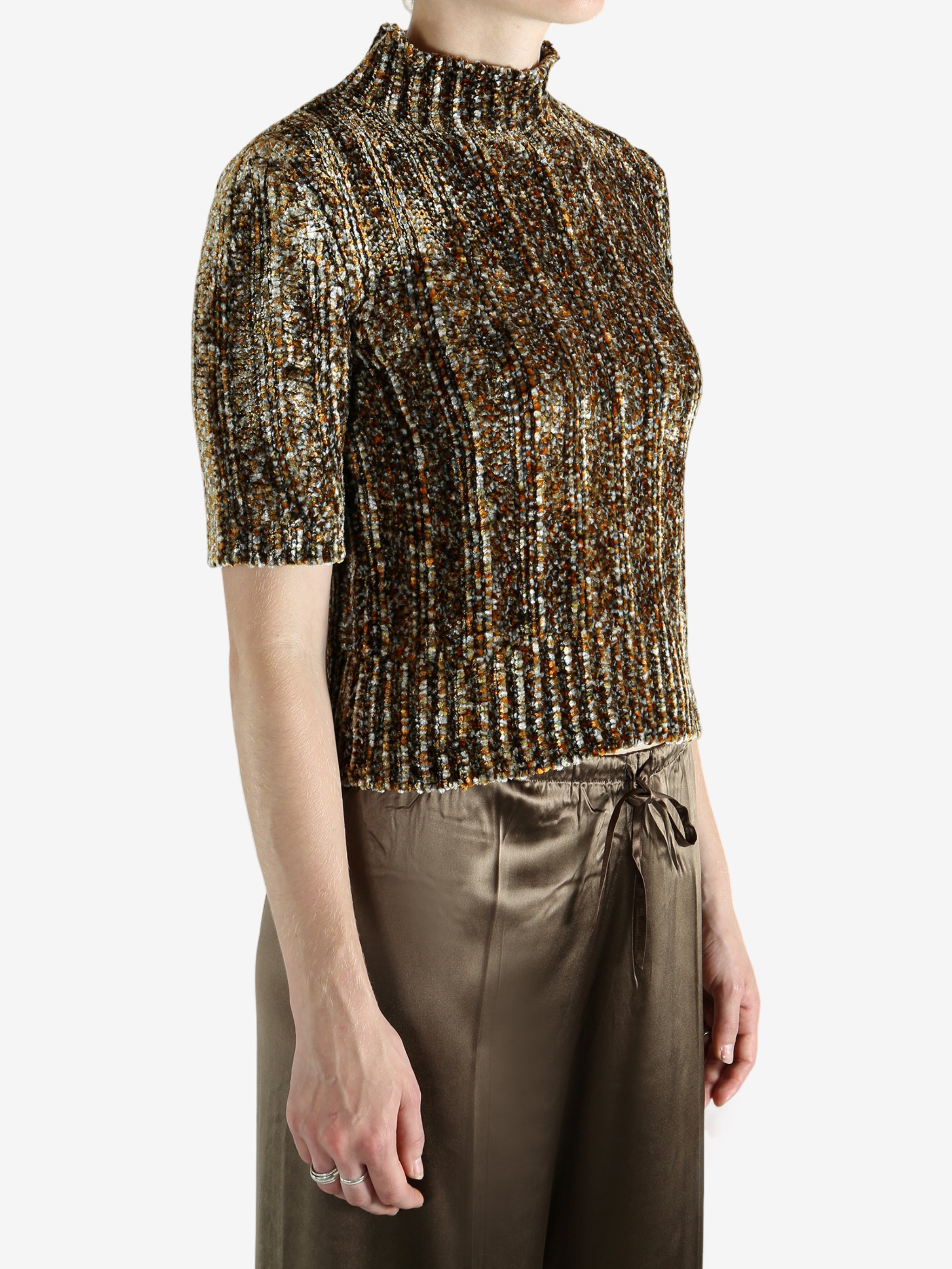 Grey knitwear worn by a person, showing the knitwear's fit