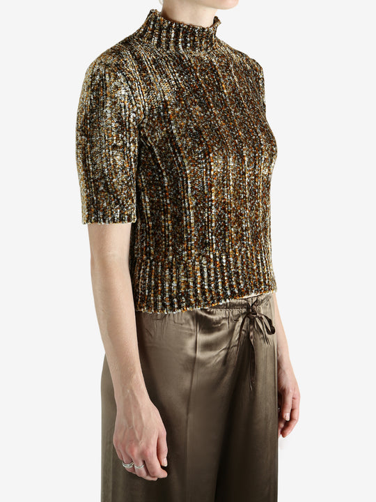 Grey knitwear worn by a person, showing the knitwear's fit