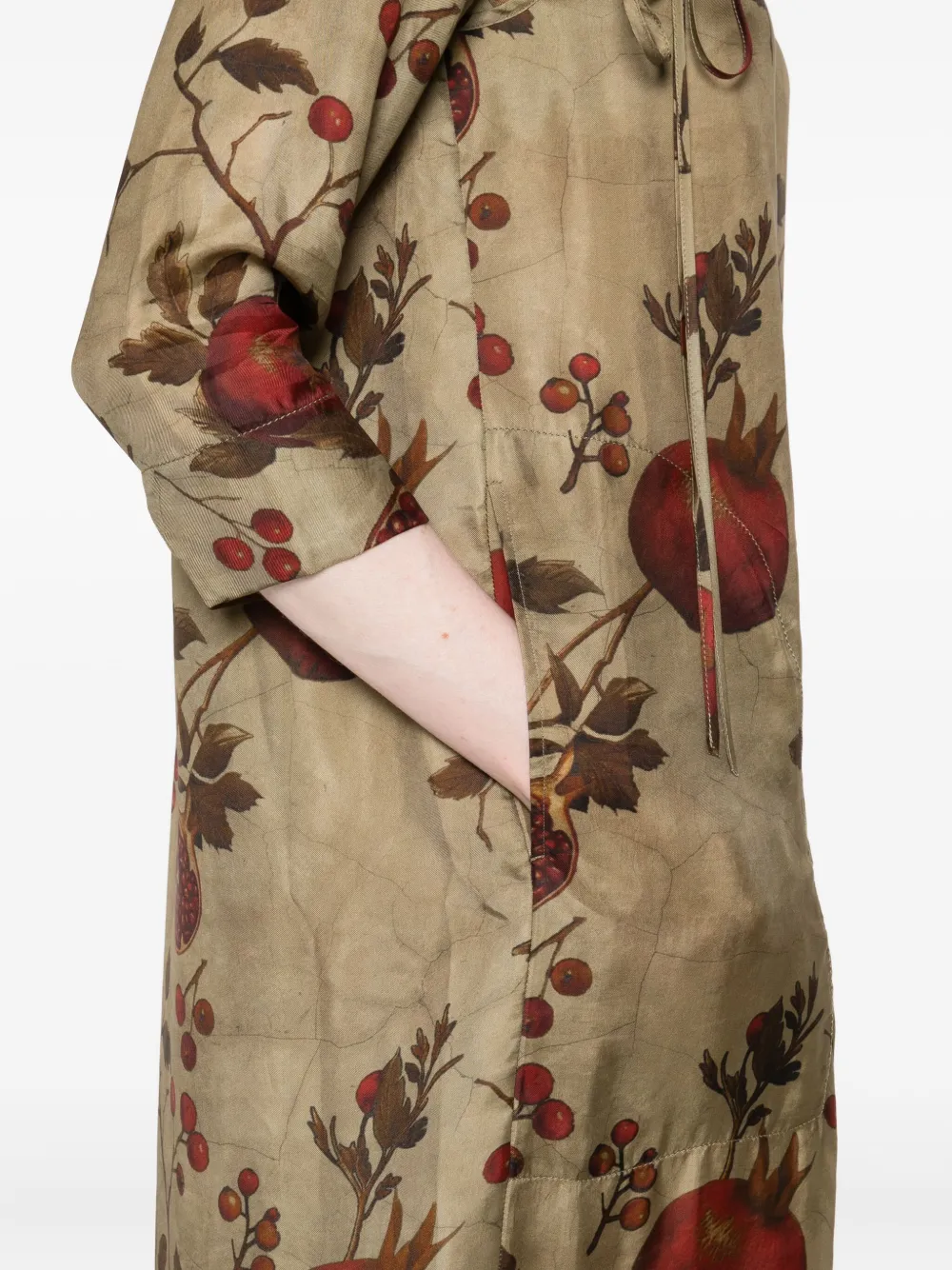 Close up of the tan dress, showing texture of the viscose and cupro fabric