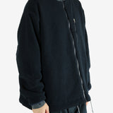 Navy jacket worn by a person, showing the jacket's fit