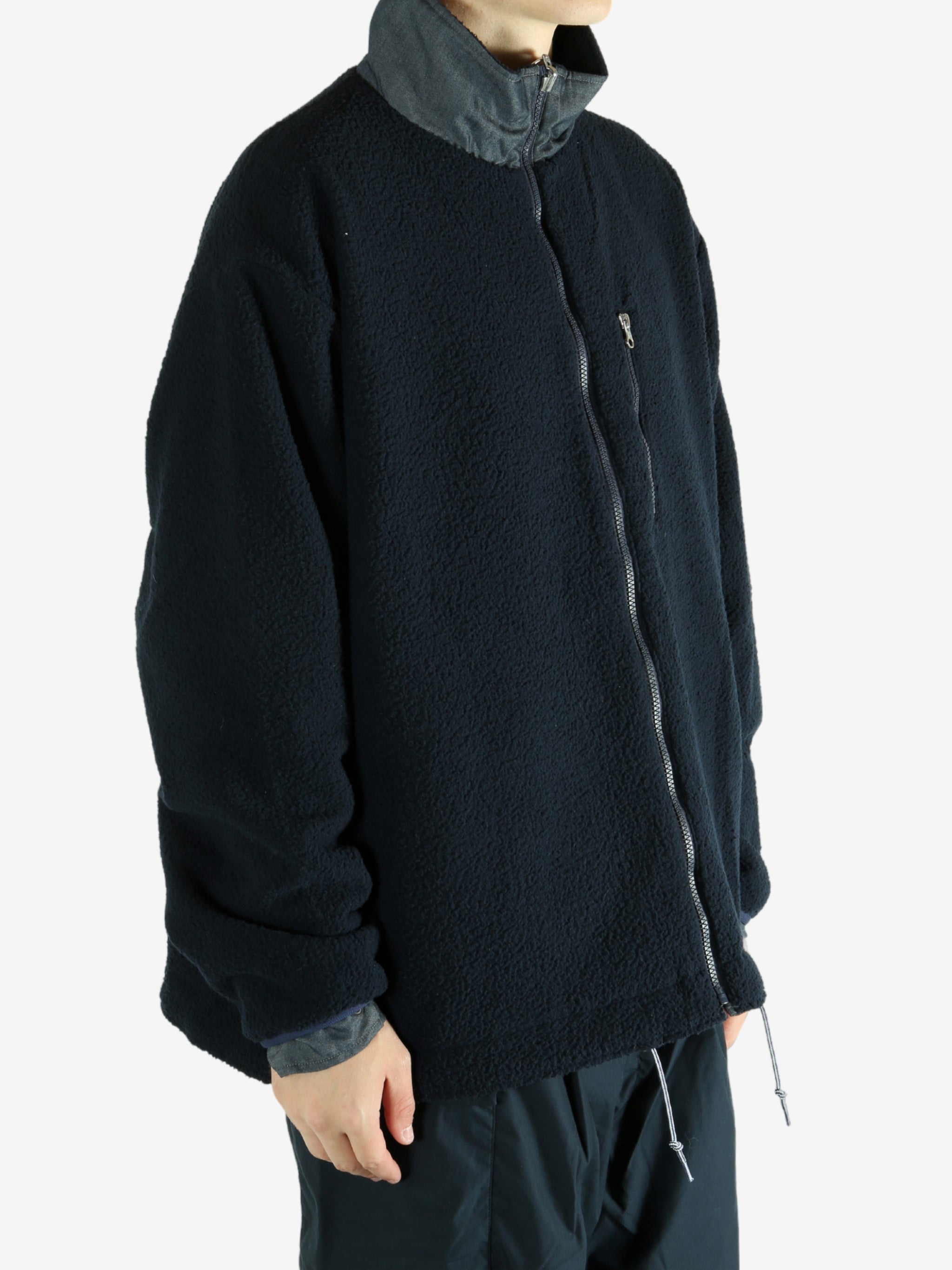 Navy jacket worn by a person, showing the jacket's fit