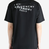 Black t-shirt worn by a person, showing the shirt's fit