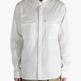 White shirt worn by a person, showing the shirt's fit