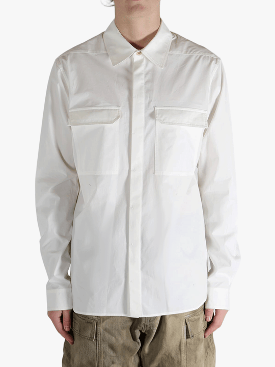 White shirt worn by a person, showing the shirt's fit