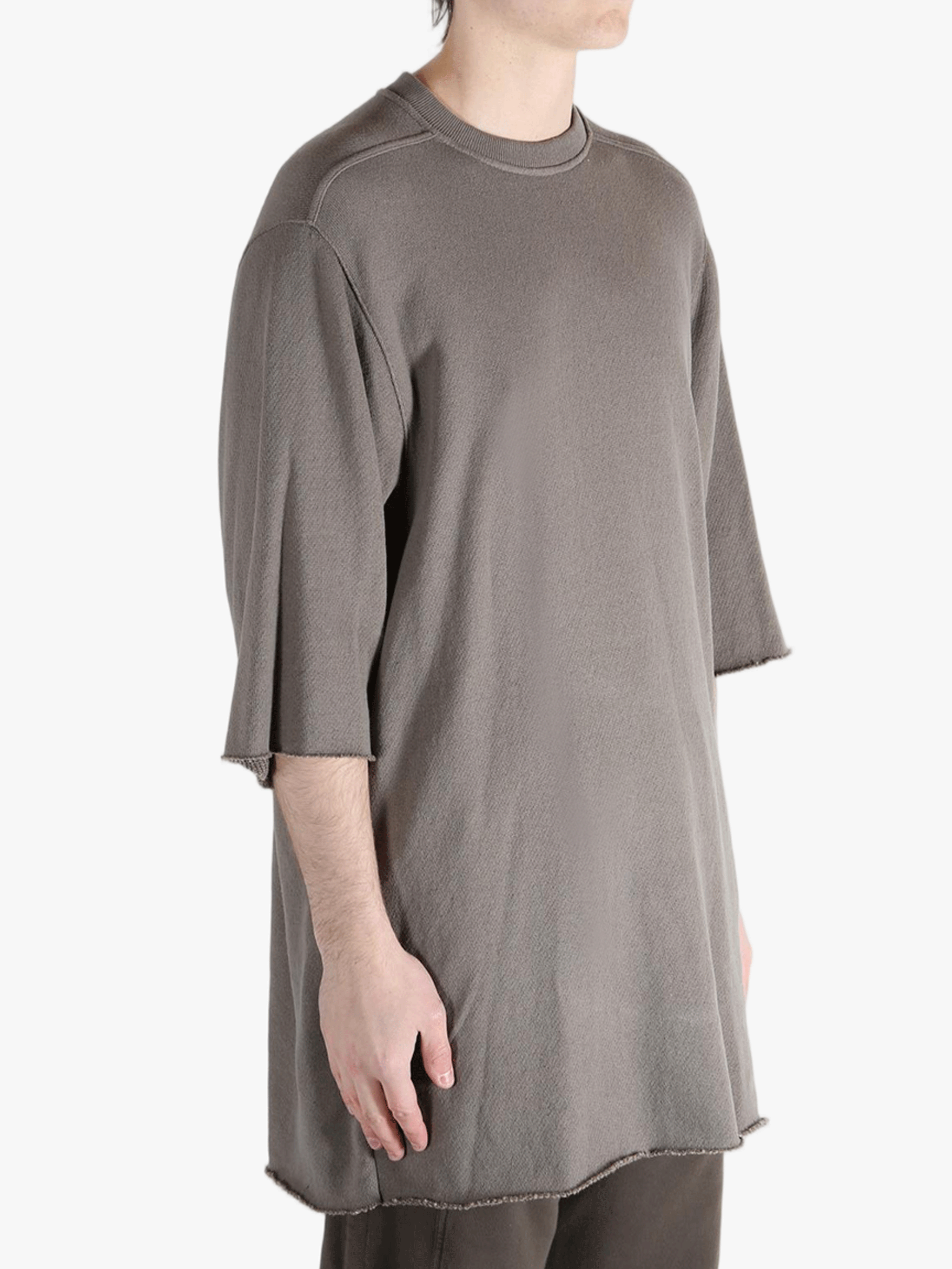 Tan t-shirts worn by a person, showing the t-shirts fit