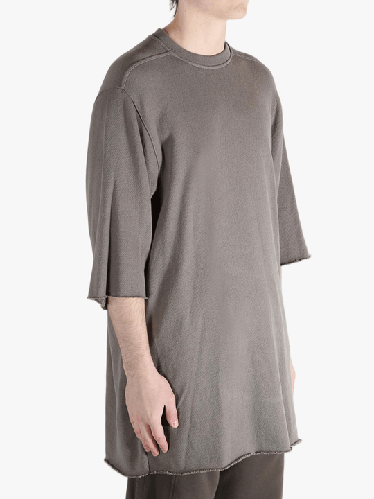 Tan t-shirts worn by a person, showing the t-shirts fit