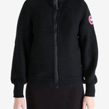 Black jacket worn by a person, showing the jacket fit