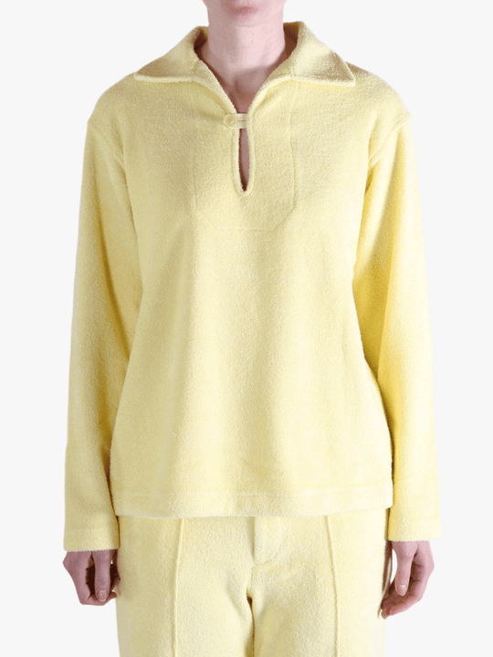 Yellow shirt worn by a person, showing the shirt's fit