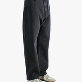 Black pant worn by a person, showing the pant's fit