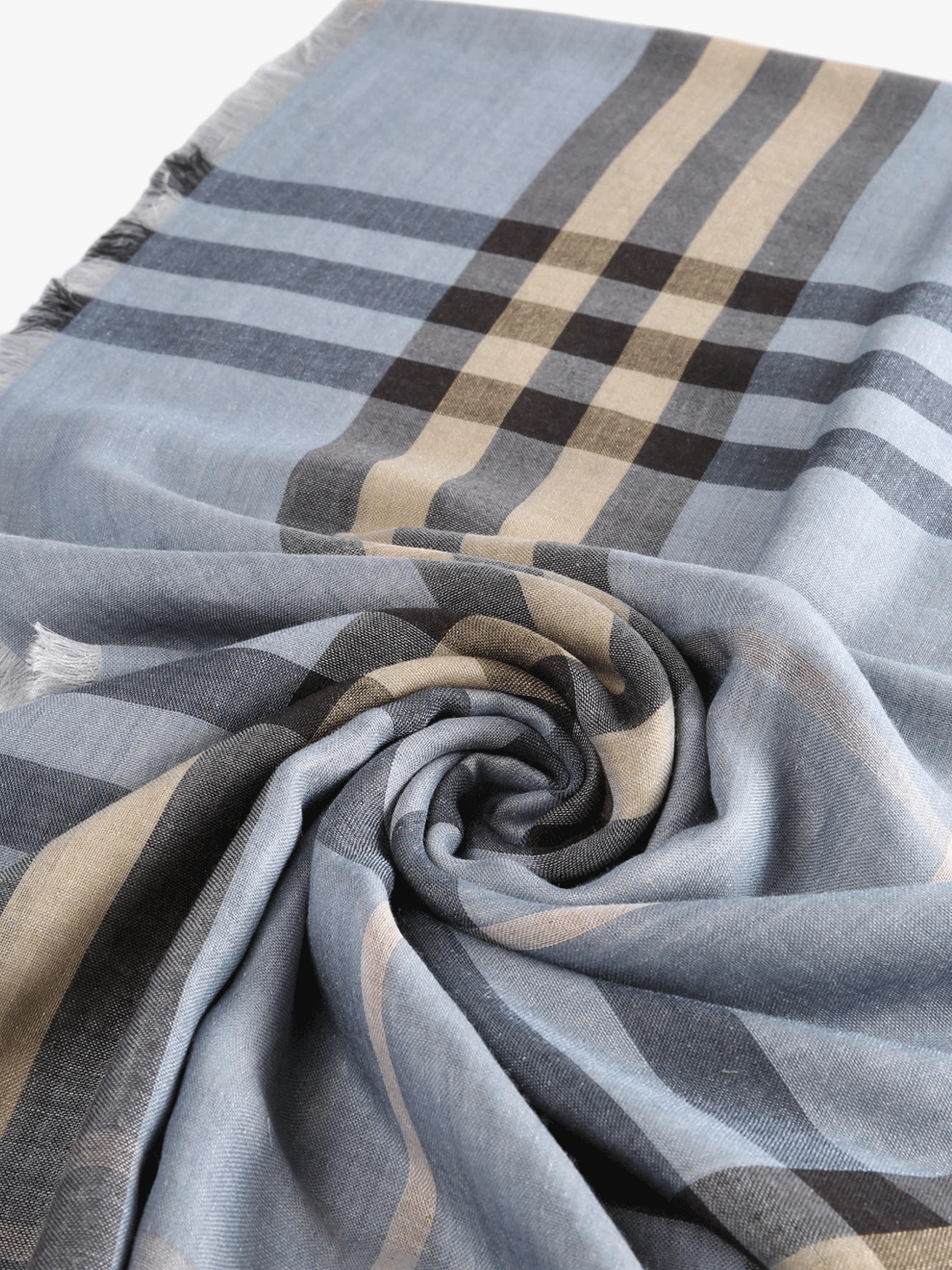 Close up of blue scarf, showing texture of the line and silk blend fabric