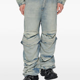 Blue pants worn by a person, showing the pants fit