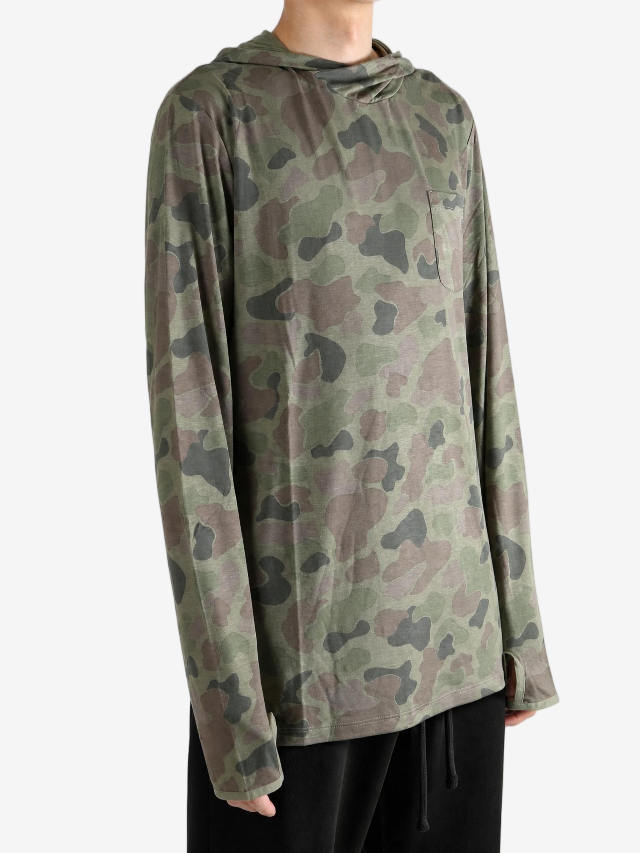 Green hoodie worn by a person, showing the hoodie fit