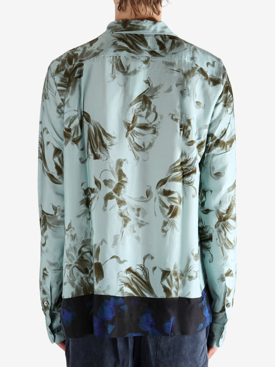 Green shirt worn by a person, showing the shirt's fit