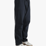 Black pants worn by a person, showing the pants fit