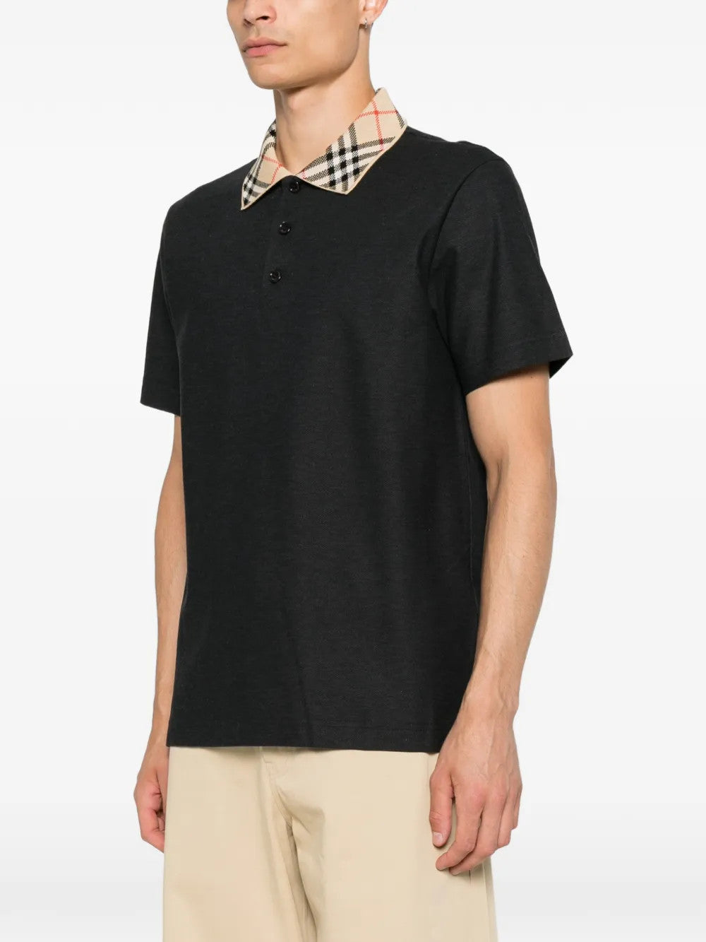 Black t-shirt worn by a person, showing the t-shirt fit
