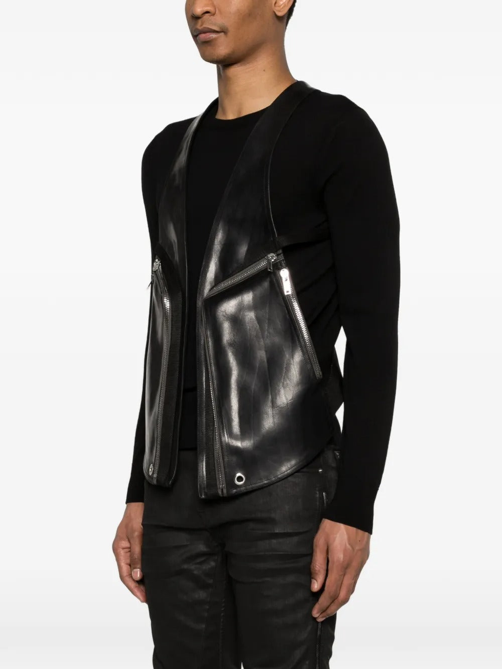 Black vest worn by a person, showing the vest's fit