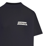 Close up of black t-shirt, showing texture of the cotton fabric