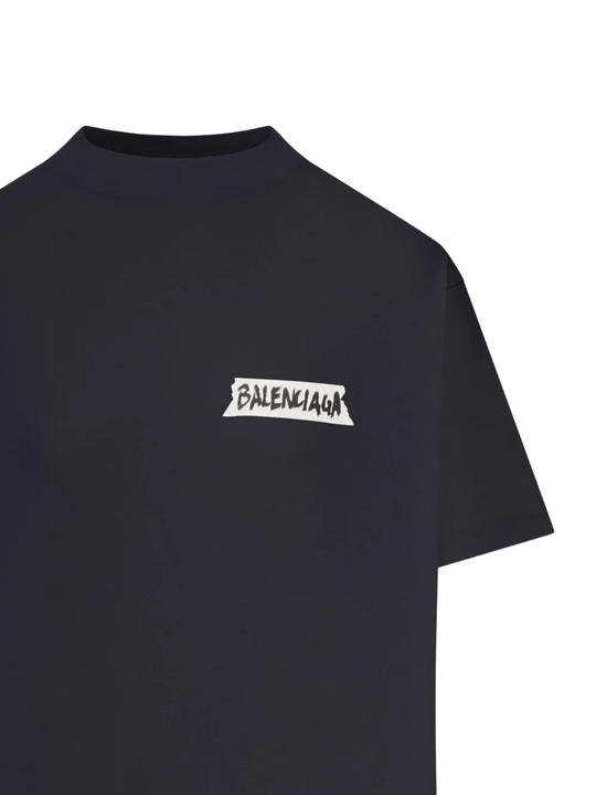 Close up of black t-shirt, showing texture of the cotton fabric