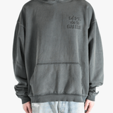 Grey hoodie worn by a person, showing the hoodie's fit