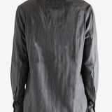 Grey shirt worn by a person. showing the shirt's fit