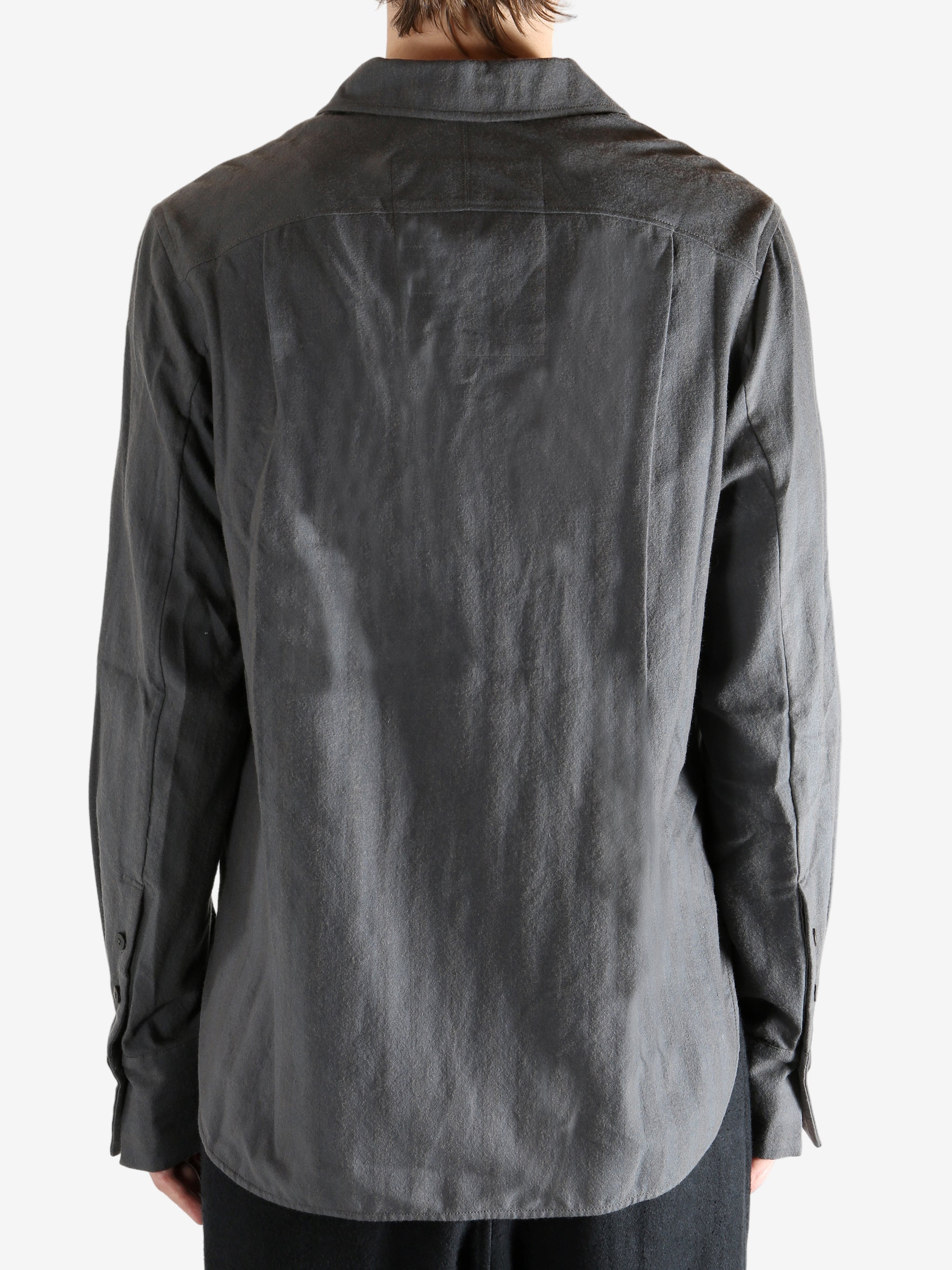 Grey shirt worn by a person. showing the shirt's fit