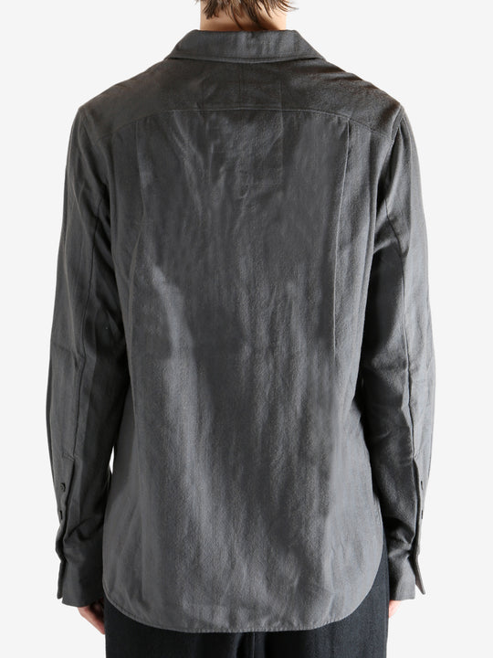 Grey shirt worn by a person. showing the shirt's fit