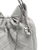 Close up of grey bag, showing texture of the leather fabric