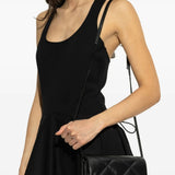 Black bags worn by a person, showing the bags fit