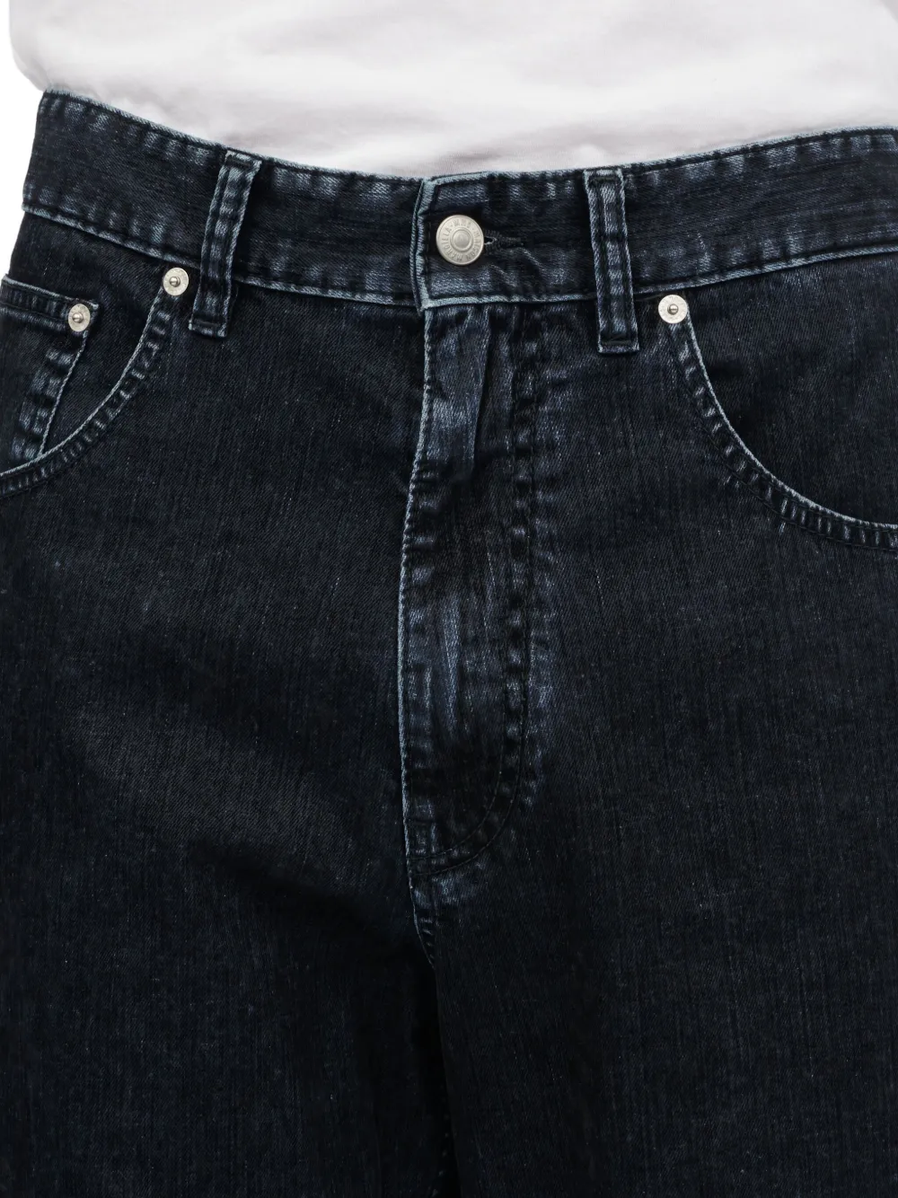 Close up of black pant, showing texture of the  cotton fabric