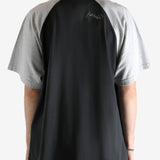 Black t-shirt worn by a person, showing the t-shirt's fit