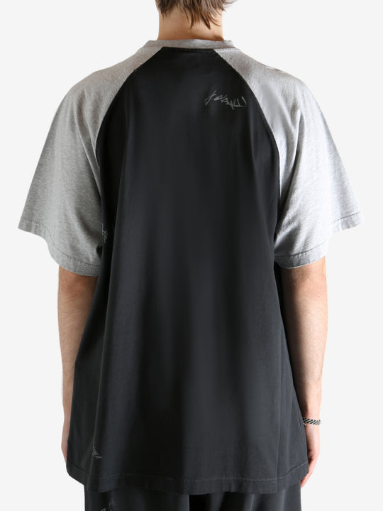 Black t-shirt worn by a person, showing the t-shirt's fit