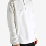 White sweatshirt worn by a person, showing the sweatshirt's fit