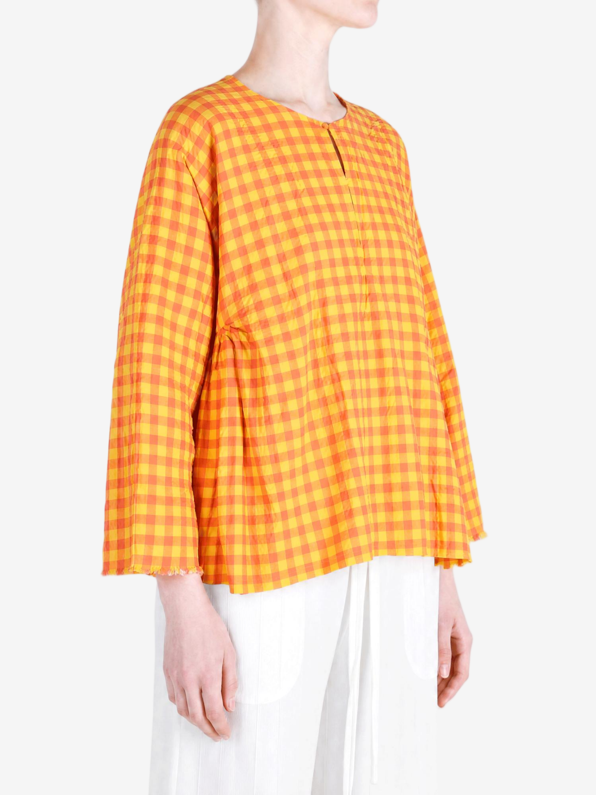 Orange shirt worn by a person, showing the shirt fit