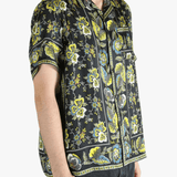 Black shirt worn by a person, showing the shirt's fit